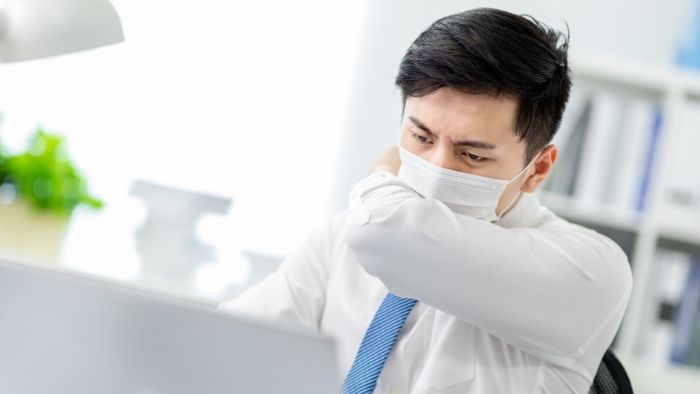 office man coughing